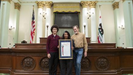 Annica Hagahorn and family on the Assembly Floor with her retirement resolution.