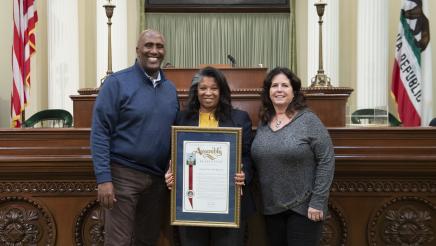 Assemblymember Cooper presents Assembly Resolution to Annica Hagahorn on her retirement.