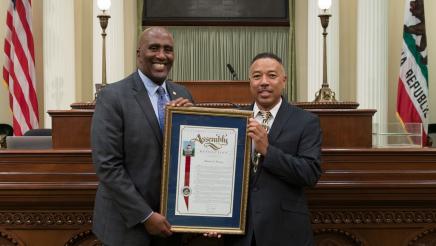 Assemblymember Cooper presenting Assembly Resolution to Mike Bradley