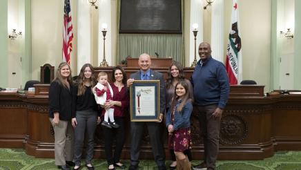 Assemblymember Cooper presents Assembly Resolution on the Assembly Floor to Anthony Quintana and his family