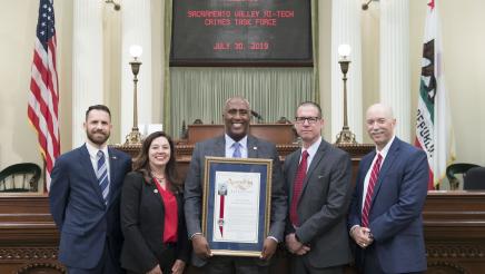 Assemblymember Cooper presenting Assembly Resolution to the Sacramento Valley Hi-Tech Crimes Task Force