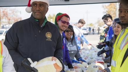Assemblymember Cooper and volunteers at turkey distribution tables