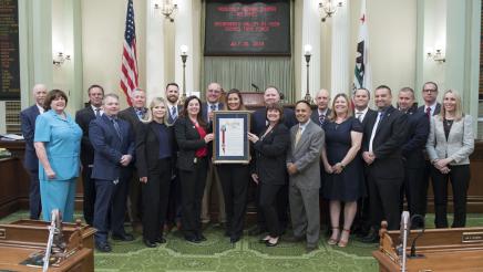 Assemblymember Cooper presenting Assembly Resolution to the Sacramento Valley Hi-Tech Crimes Task Force